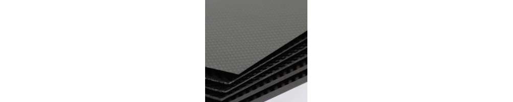 Sample of carbon fiber, kevlar or carbon-kevlar sheet on one side.